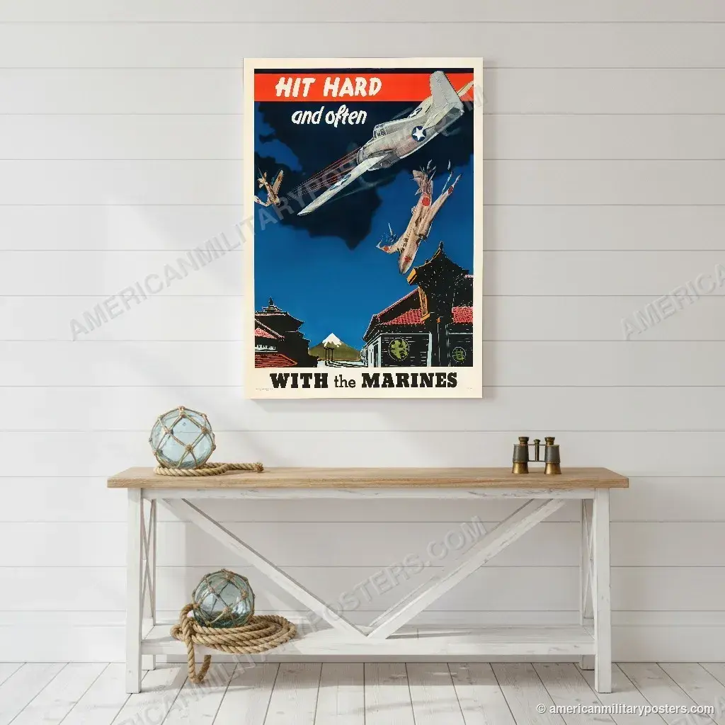 Hit Hard and Often With the Marines poster, unframed print on a white shiplap wall in a coastal hallway
